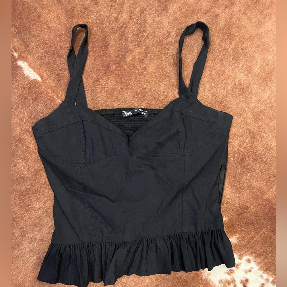 Black peplum style top